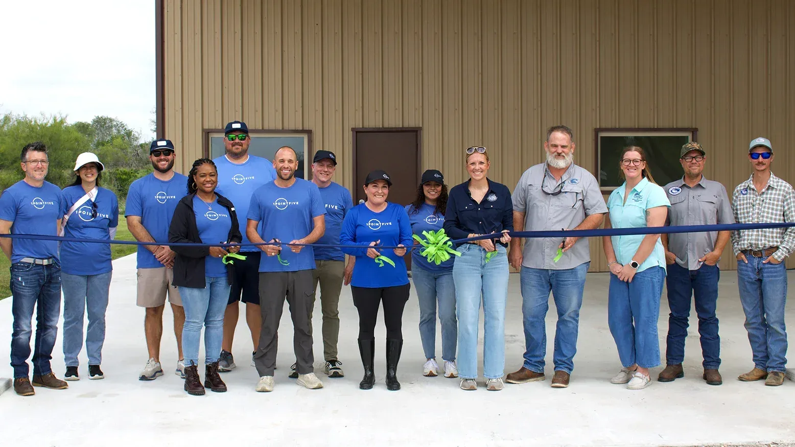 1PointFive Team Members and Coastal Bend Bays & Estuaries Program in front of building cutting ribbon