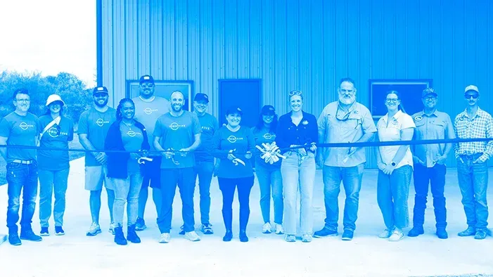 1PointFive Team Members and Coastal Bend Bays & Estuaries Program in front of building cutting ribbon
