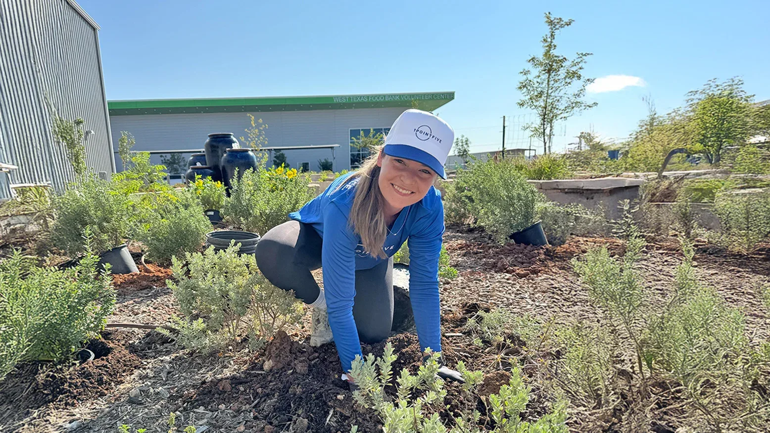 1PointFive Volunteer planting in the butterfly garden at West Texas Food Bank